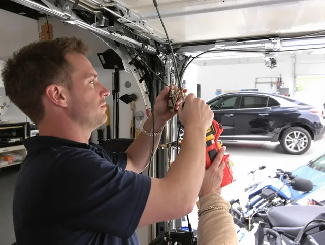 Warwick Garage Door Repair safety certified technician performing cable replacement in Warwick