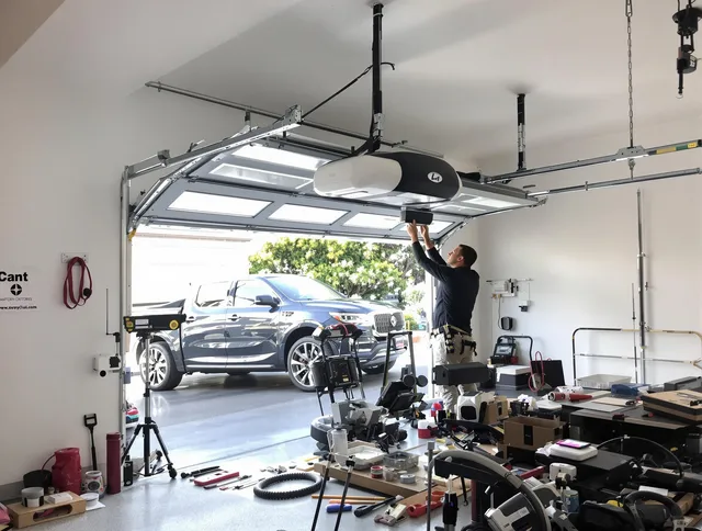 Warwick Garage Door Repair specialist installing smart garage door opener system in Warwick home